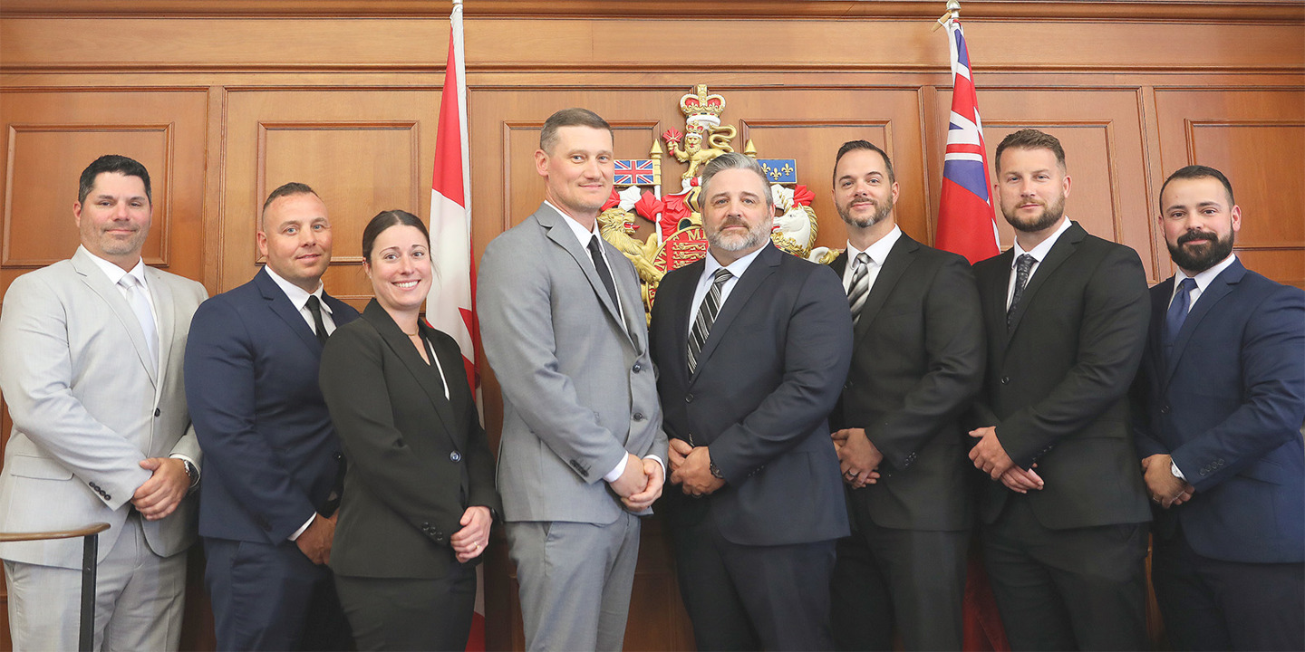Newly sworn-in Municipal Special Constables, pictured standing (left to right): Dan Hazell, John Tobin, Laura St. Pierre, Kyle Compeau, Steve Mothersell, Jamie Goose, Ryan Burns, and Jon Baldwin.