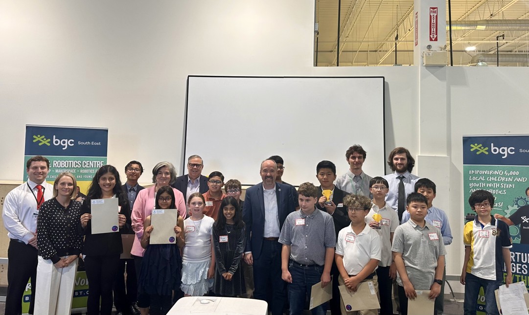 Mayor Paterson standing among participants of the Jr. Mayor's Innovation Challenge Showcase.