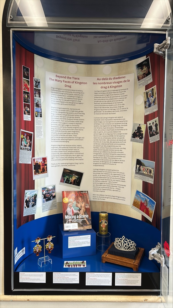 Exhibit space showcasing drag in Kingston, featuring jewelry and stories.